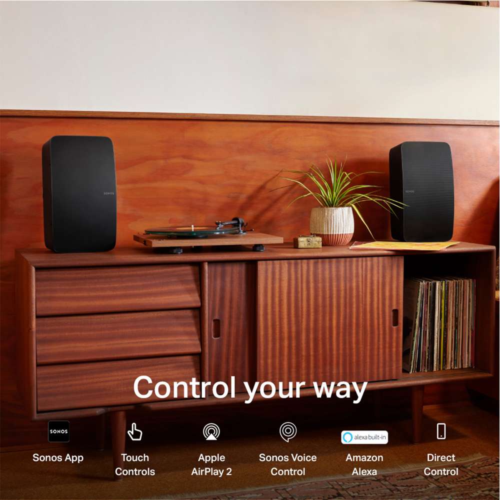Black Sonos Five Speaker a pair of the speakers on a wooden credenza beside a record player with the words Control your way and icons for Sonos App, Touch Controls, Apple AirPlay 2, Sonos Voice Control, Amazon Alexa and Direct Control