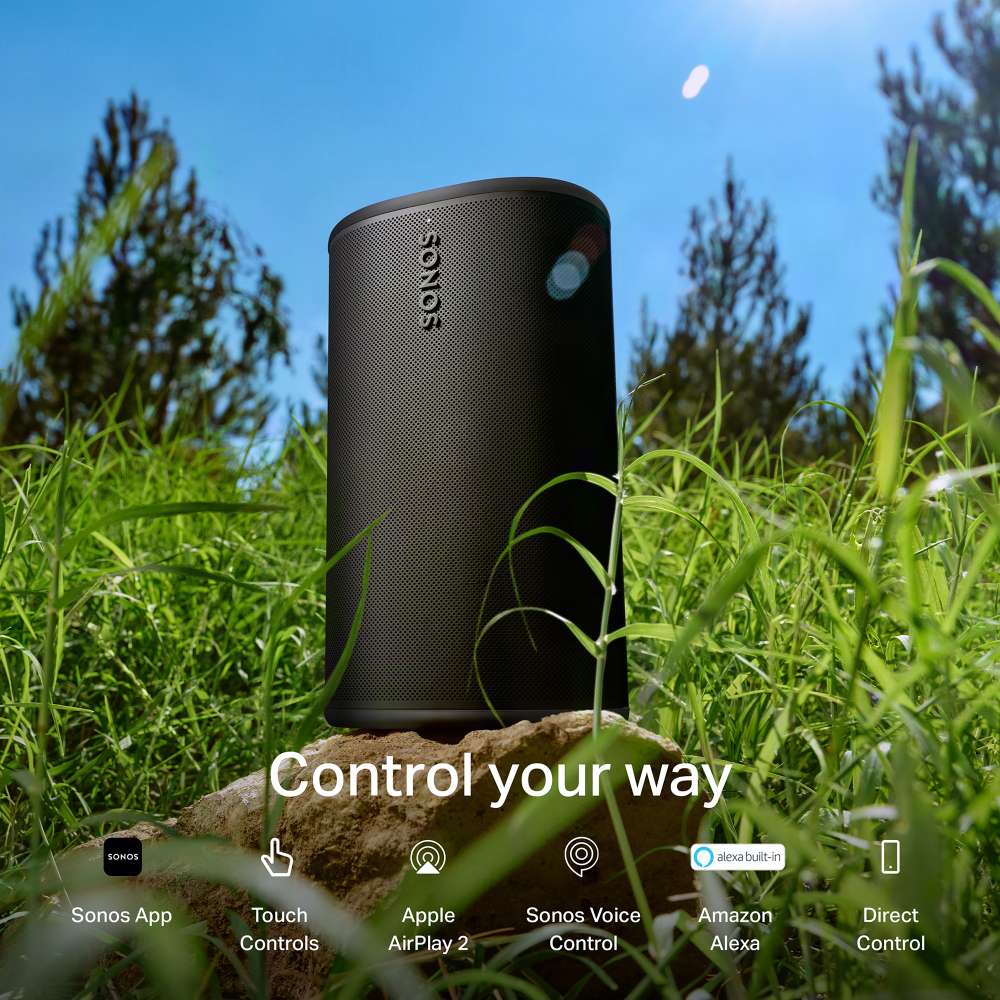 Black Sonos Play Portable Bluetooth Speaker standing on a rock in tall grass under a blue sky with the words Control your way and icons for Sonos App, Touch Controls, Apple AirPlay 2, Sonos Voice Control, Amazon Alexa and Direct Control