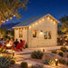 BlueWater Bungalow 160 illuminated for a bright Nevada sports night, with friends watching a game inside while another group gathers around an outdoor fire feature.
