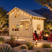BlueWater Freedom Loft Studio illuminated for a bright Nevada sports night, with friends watching a game inside and gathering around a fire feature beneath the mountain skyline.
