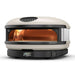 Bone Gozney Arc XL Pizza Oven angled front view on white with a flame burning inside the copper-toned dome and the display reading 950.