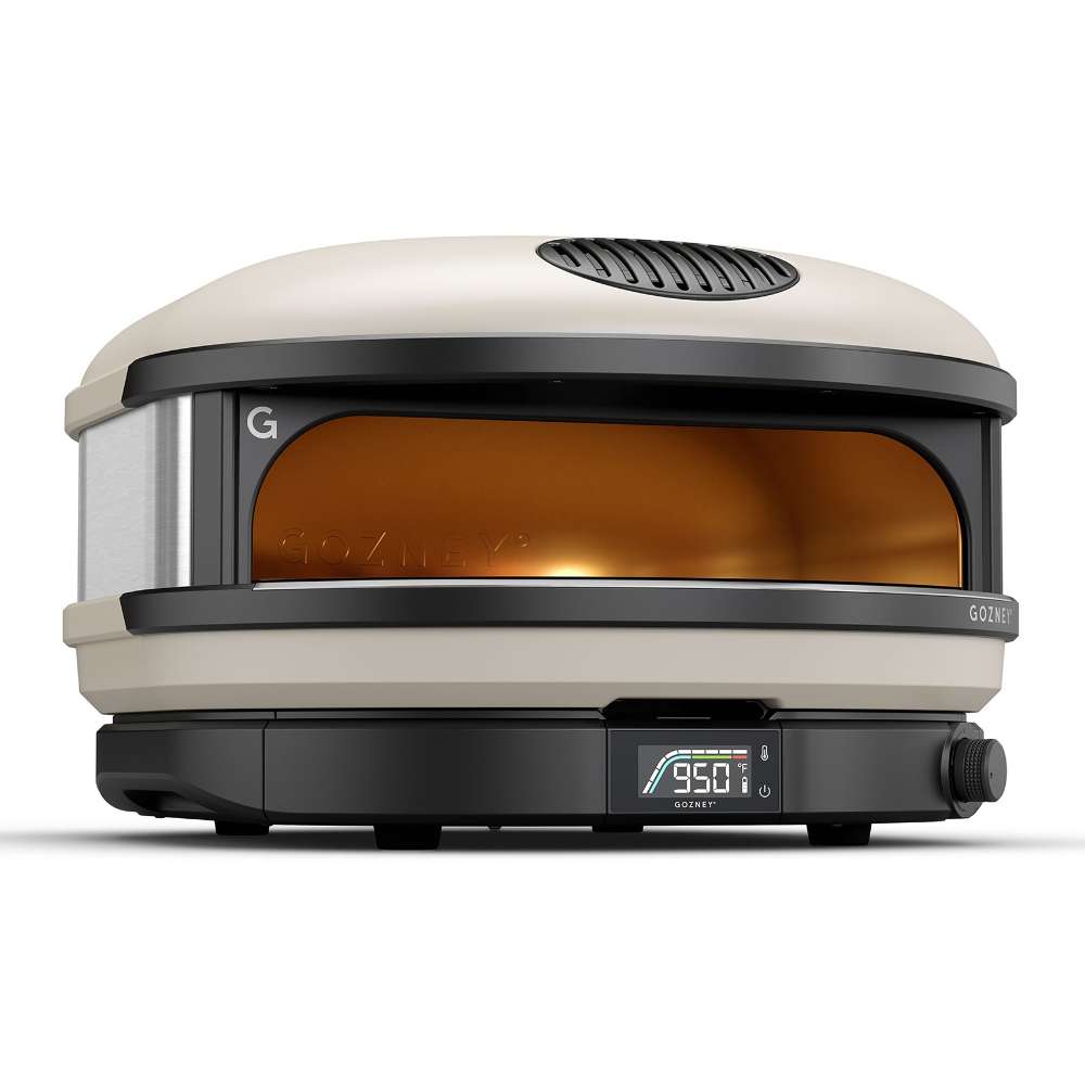 Bone Gozney Arc XL Pizza Oven angled view on white showing the cream shell the stainless side panel and the display reading 950.