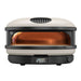 Bone Gozney Arc XL Pizza Oven straight-on front view on white with the cream shell the copper-toned dome interior and the display reading 950.