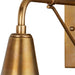 Brass Crate & Barrel Mariner Outdoor Wall Sconce mounted on an exterior wall casting warm downward light