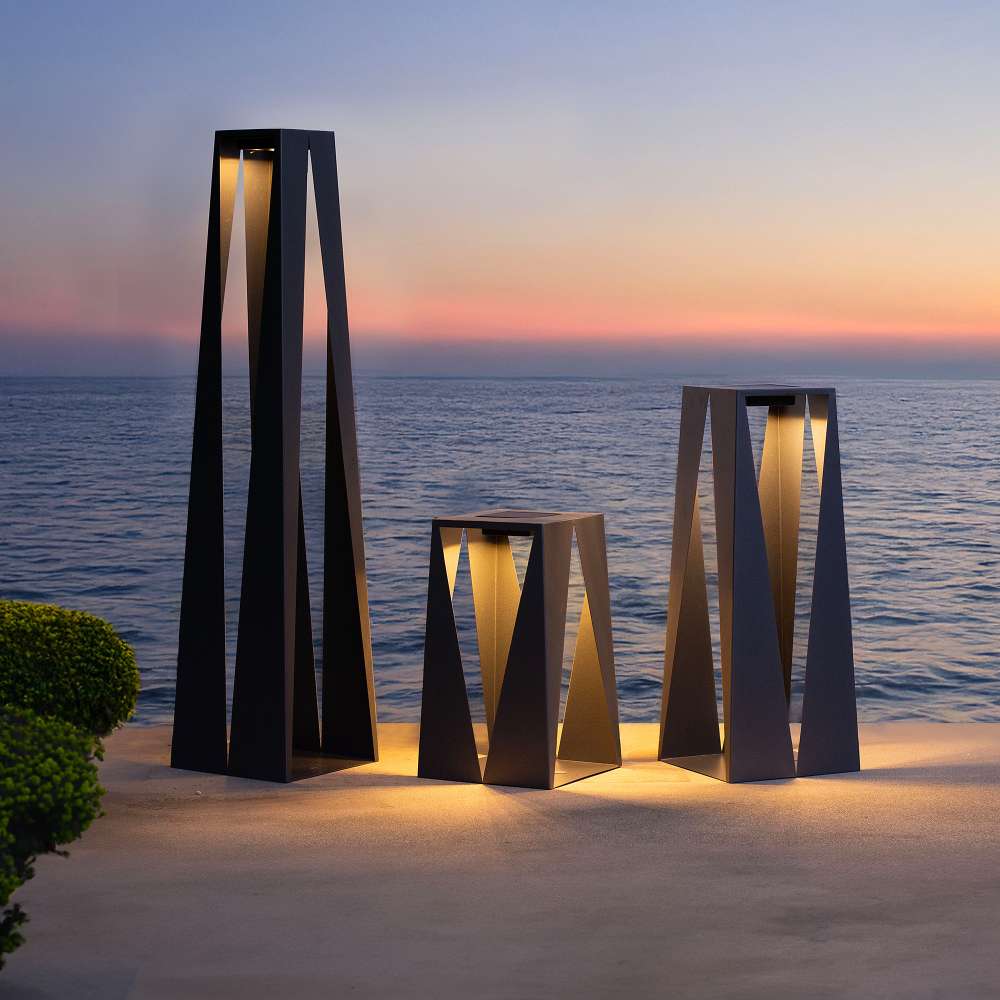 Cafe Brown Crate & Barrel Teatree Cafe Metal LED Solar Outdoor Lantern in carbon steel giving 500 lumens of warm 2,200K light, shown in the third alternate view