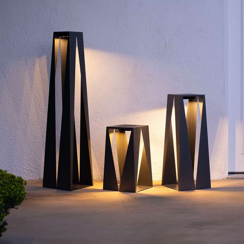 Cafe Brown Crate & Barrel Teatree Cafe Metal LED Solar Outdoor Lantern in carbon steel with the 20 inch and 30 inch heights together, shown in the fourth alternate view