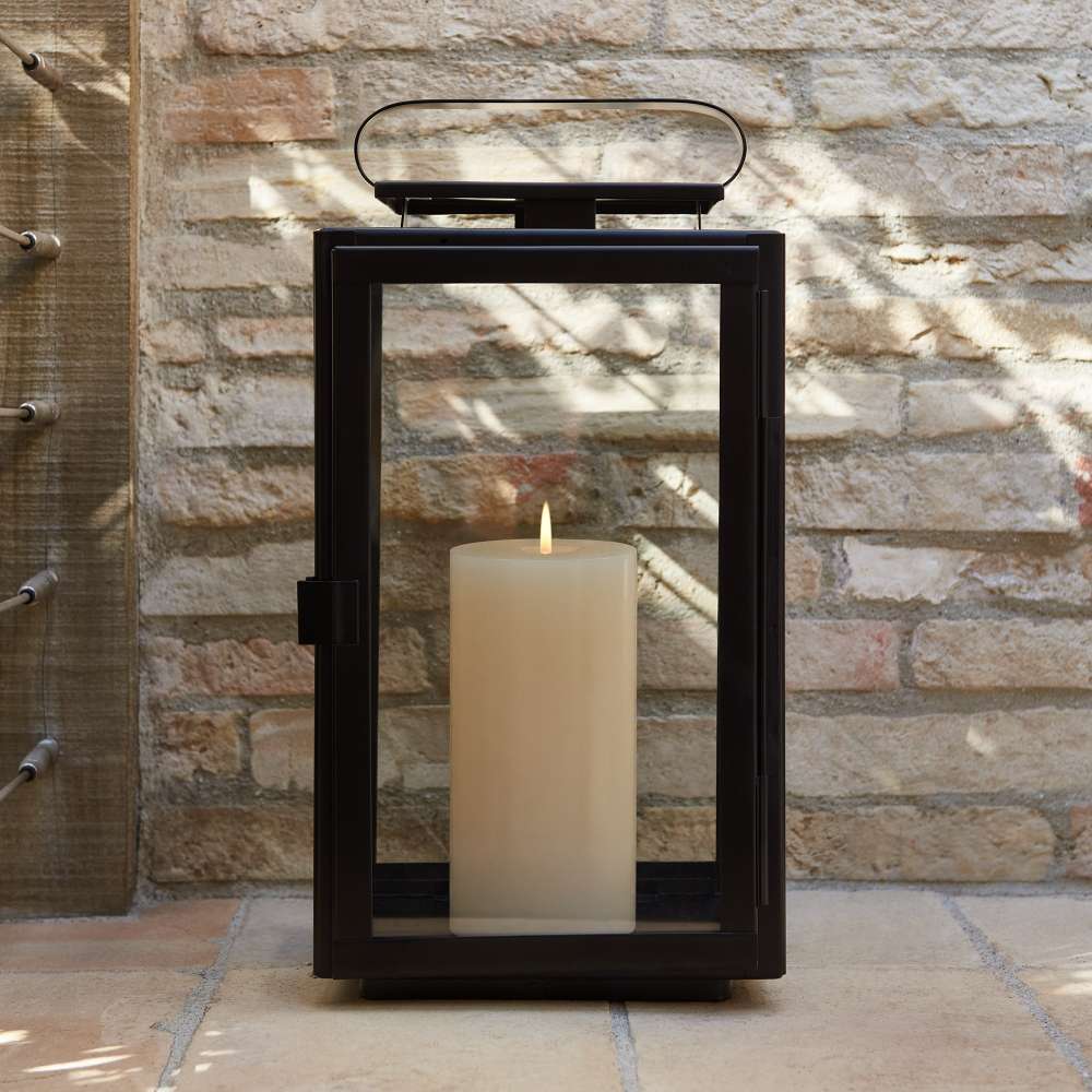 Crate & Barrel Walker Black Metal Outdoor Lantern detail shot highlighting geometric iron frame and glass