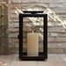 Crate & Barrel Walker Black Metal Outdoor Lantern detail shot highlighting geometric iron frame and glass