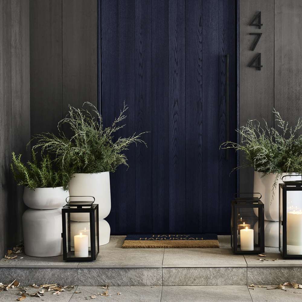 Crate & Barrel Walker Black Metal Outdoor Lantern featuring clean geometric lines and crisp black iron frames
