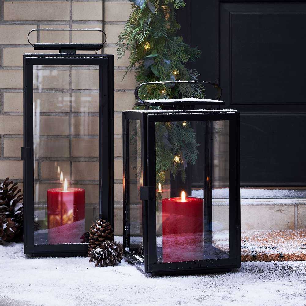 Crate & Barrel Walker Black Metal Outdoor Lantern detail showing glass panes and protective frame construction