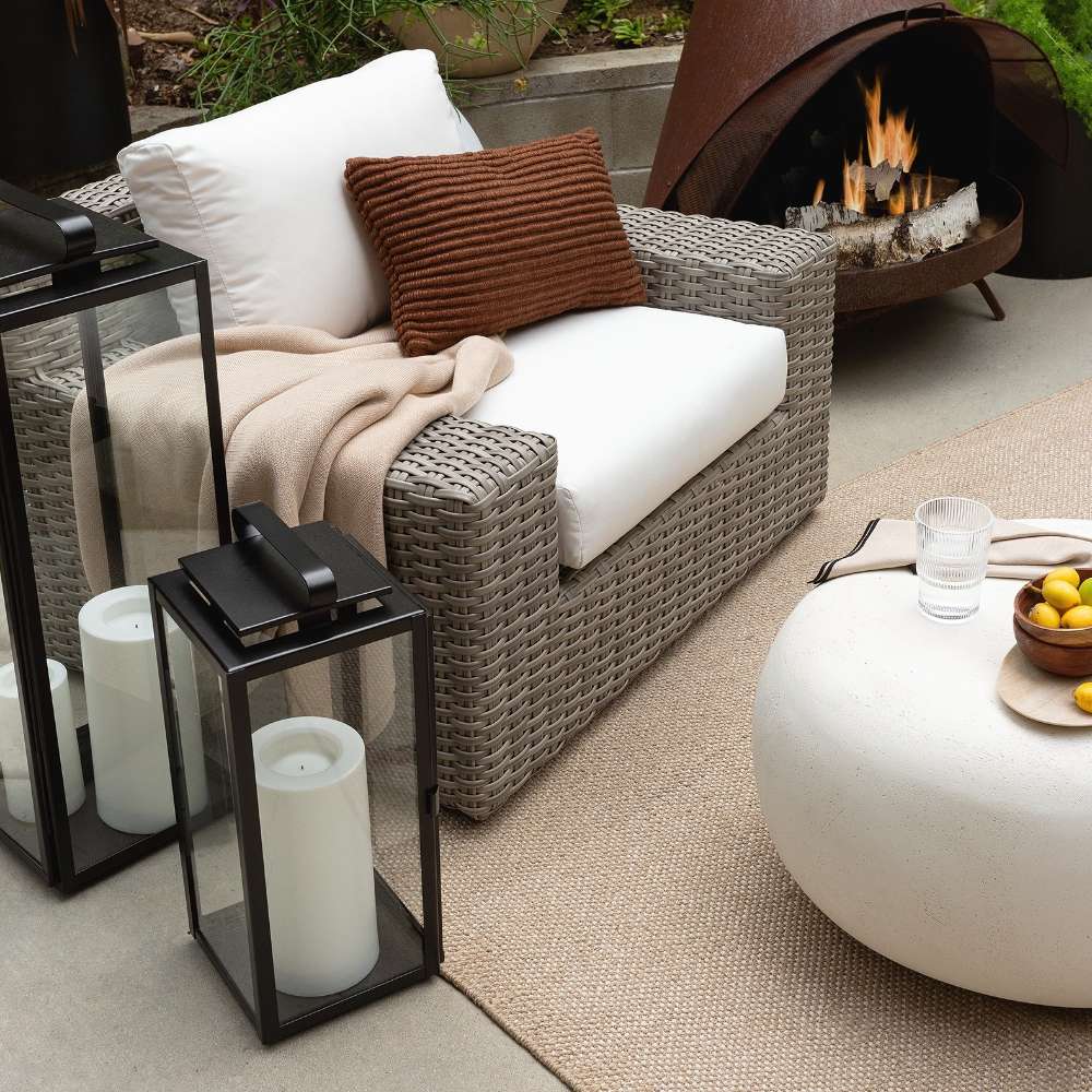 Crate & Barrel Walker Black Metal Outdoor Lantern with protective glass panes and oblong handles for outdoor displays