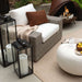 Crate & Barrel Walker Black Metal Outdoor Lantern with protective glass panes and oblong handles for outdoor displays
