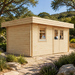 Rectangular light wood Miriam 44A Classic studio with a flat roof, glass window, and double doors in a garden setting.