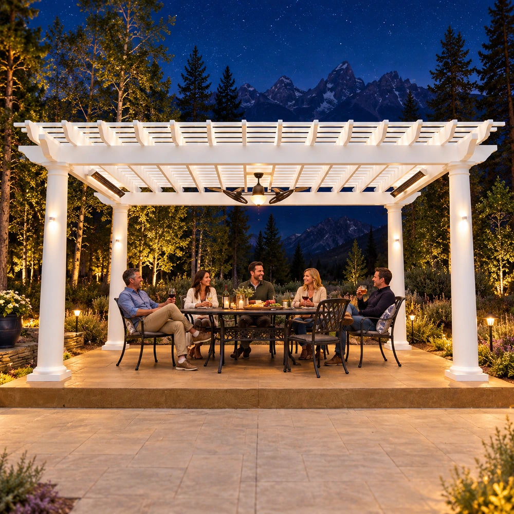 Five adults enjoy drinks beneath a brightly illuminated white StructureWorks Trex pergola in a Wyoming backyard with mountains and a starry night sky.