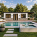 Modern Tremblant Garden Suites with white siding, stone base, black-trimmed windows, covered dining patio, serene pool, and raised spa.
