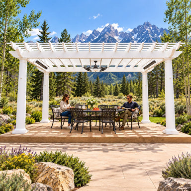 Two adults work and study beneath a white StructureWorks Trex pergola in a sunny Wyoming backyard overlooking the Teton Mountains.