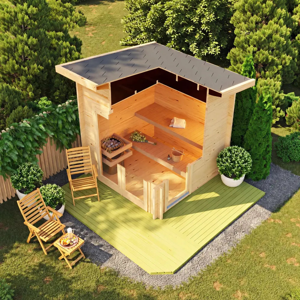Overhead cutaway view of the Sawmill Structures Versa Sauna showing wooden benches, a stone heater, sauna accessories, and the surrounding garden.