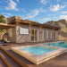 Banff Garden Suites exterior with sleek wood cladding, large glass doors, a spa-style pool, landscaped deck, and dramatic mountain backdrop.
