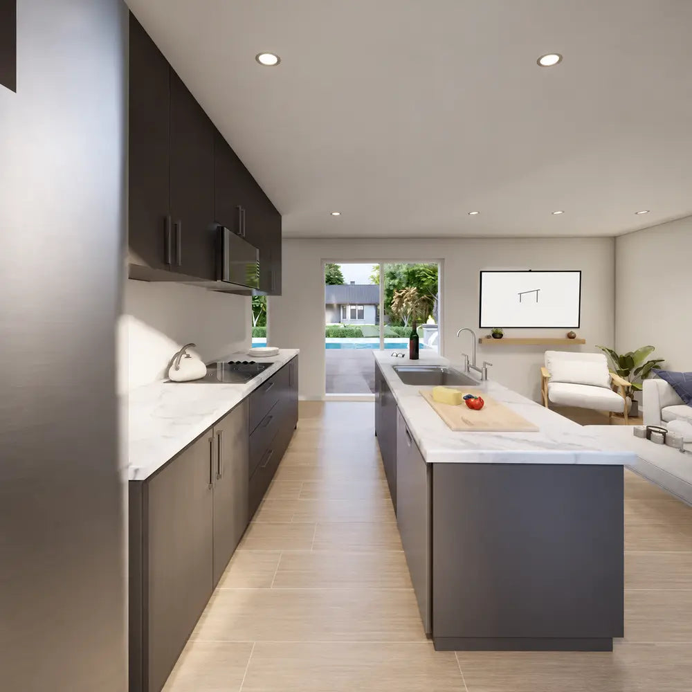 Bright Jasper Garden Suites interior with dark kitchen cabinetry, marble counters, a central island, cozy seating, and glass doors overlooking the pool.