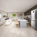 Open-concept Banff Garden Suites kitchen and living area with neutral finishes, modern furniture, a large island, and expansive poolside windows.