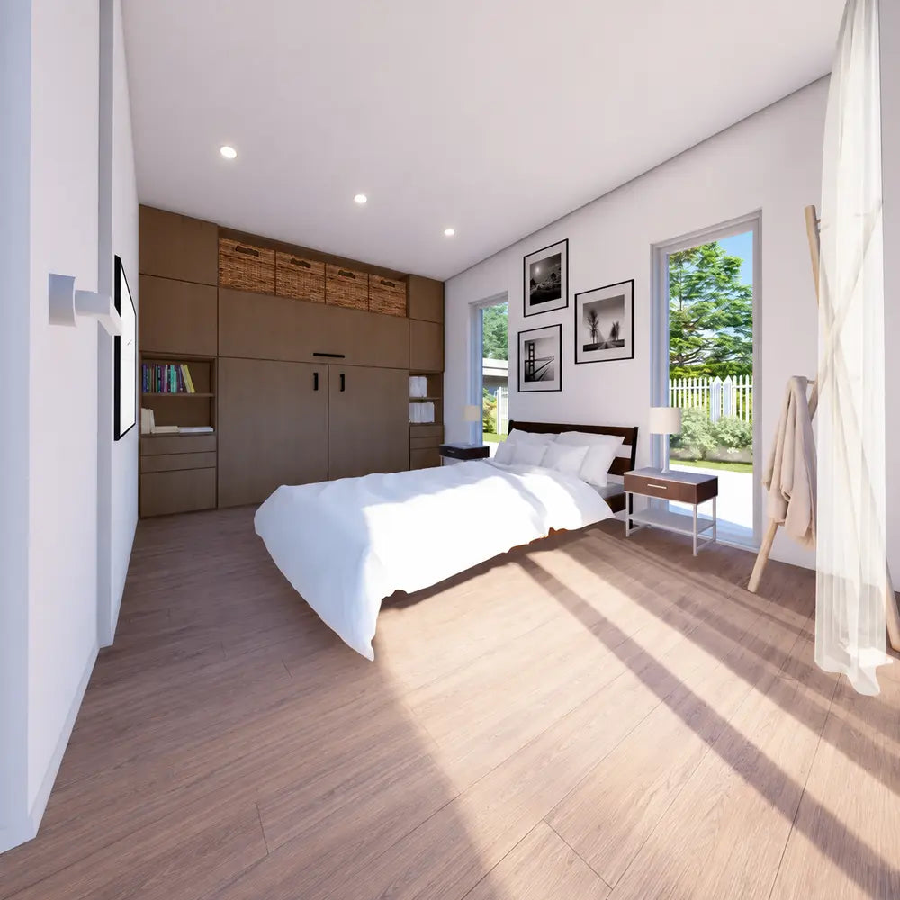 Cozy bedroom inside the Muskoka Garden Suites with a large bed, tall windows, framed artwork, bedside tables, and built-in wood storage.
