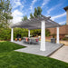 Two-tone Structureworks Trex Pergola with gray rafters and white posts covering a modern dining set on a spacious backyard deck.