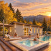 The Banff one-bedroom suite glowing at golden hour in Colorado as four adults relax with drinks beside the pool and spa, surrounded by autumn aspens and mountain scenery.