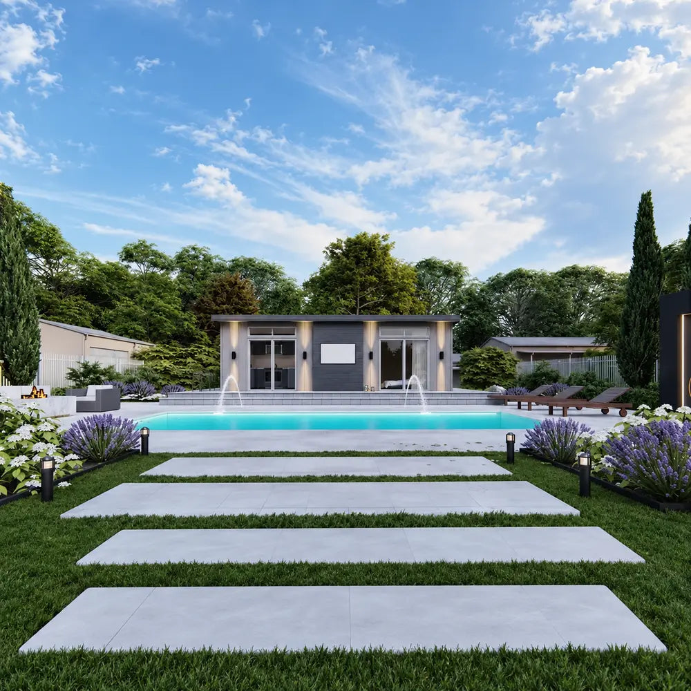 Centered front view of the Muskoka Garden Suites with clean architectural lines, a central pool, fountain jets, lounge chairs, pathway lights, and lush landscaping.