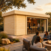 Rectangular light wood studio with glass doors and a bar interior, set on a stone patio with people by a fire pit.