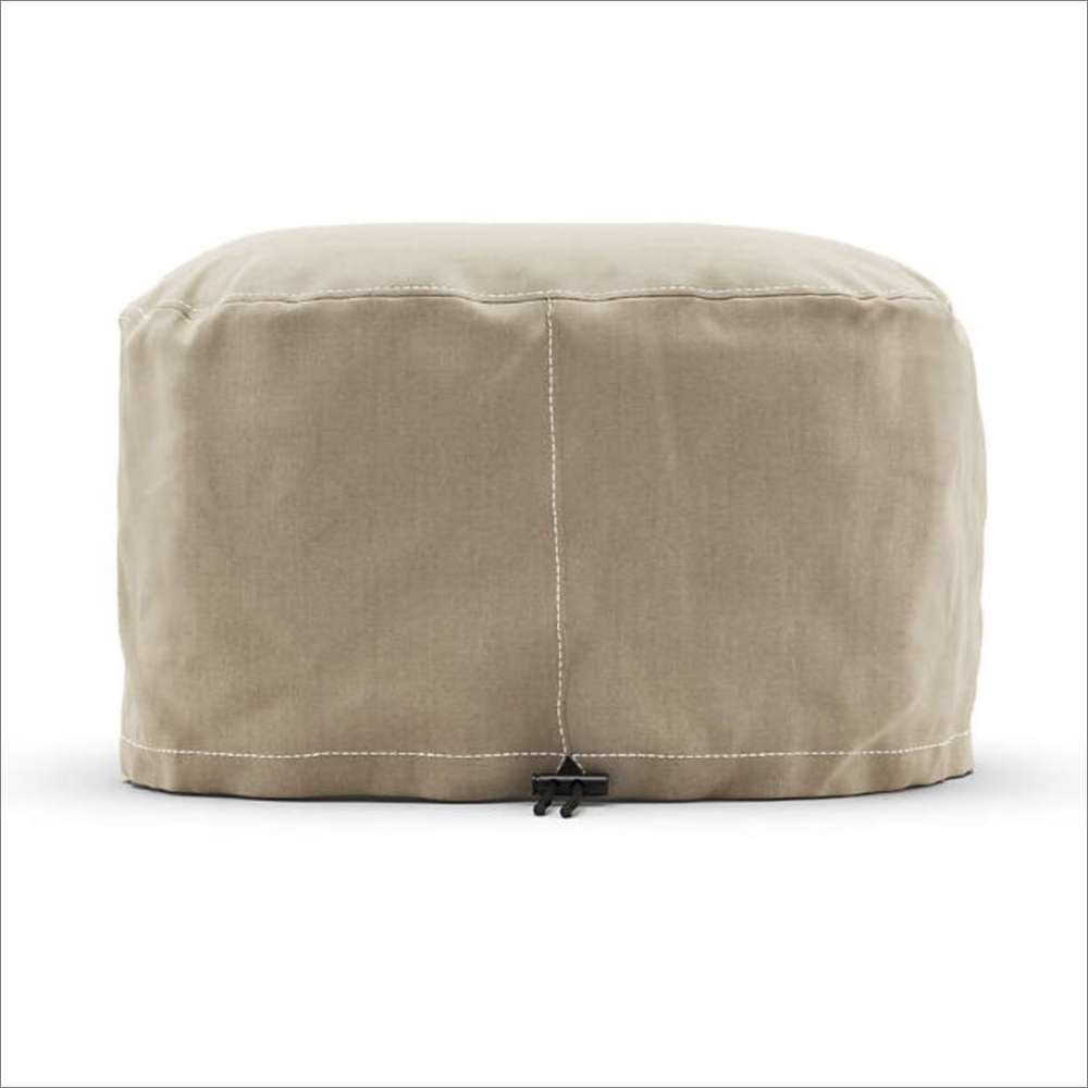Gozney Arc Lite Pizza Oven Cover from the back on white showing the plain sand-colored panel with its center seam and a toggle at the hem.