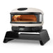 Gozney Arc Pizza Oven Booster on white with a Bone Arc oven standing on it at an angle and the display reading 450.