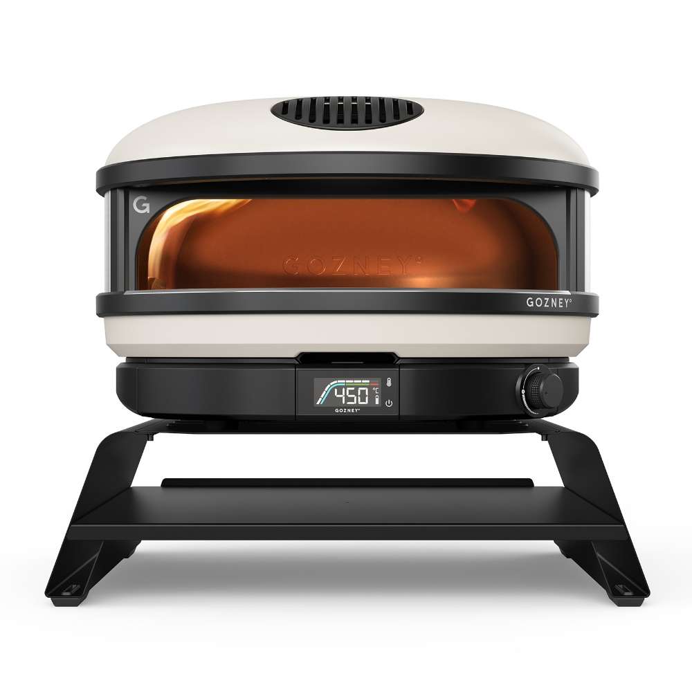 Gozney Arc Pizza Oven Booster on white with a Bone Arc oven standing on it seen from the front and the display reading 450.