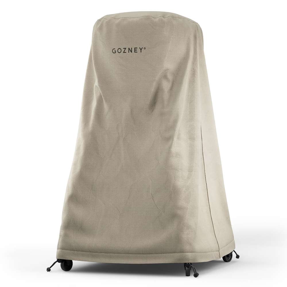 Gozney Arc Pizza Oven + Stand Cover angled view on white with the Gozney wordmark on the front panel and the toggles at the bottom hem.