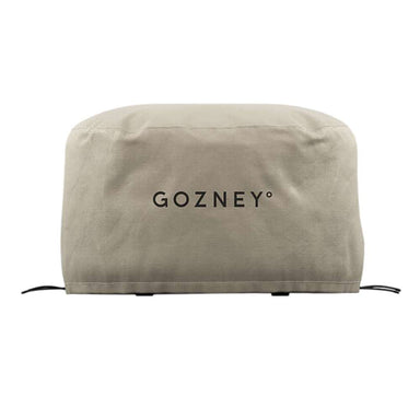 Gozney Arc Pizza Oven XL Cover on white from the front showing the stone-colored canvas cover with the Gozney wordmark and the drawcord at the hem.