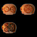 Gozney Dome Gen 2 Natural Gas Pizza Oven capacity diagram on black showing overhead views of the stone floor holding two small pizzas one large pizza and two skillets beside a tray of whole fish.