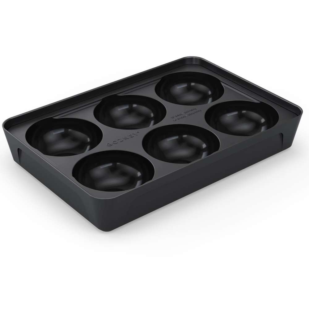 Gozney Pizza Dough Tray angled view on white of the black tray with the lid off showing its six empty round dough wells.