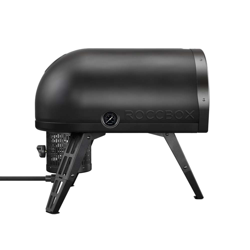 Gozney Roccbox Black Outdoor Portable Pizza Oven rear angled view on white showing the Roccbox name on the shell the round temperature dial and the gas hose at the back.