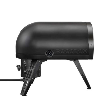 Gozney Roccbox Black Outdoor Portable Pizza Oven rear angled view on white showing the Roccbox name on the shell the round temperature dial and the gas hose at the back.