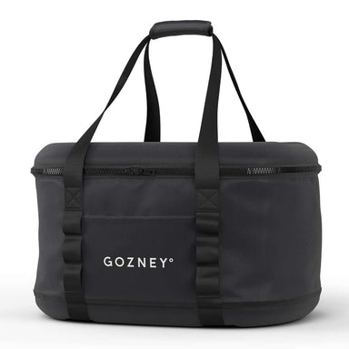 Gozney Tread Travel Bag angled on white showing the zippered black shell and the twin webbing handles.