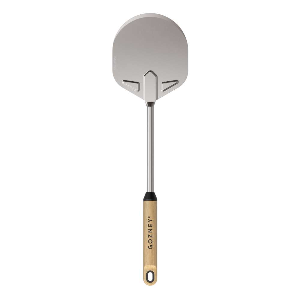 Gozney Venture Turning Peel upright on white with the round stainless head at the top and the wood handle hanging below.