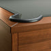 Grey Crate & Barrel Walnut Pool Table with Wall Rack and Accessories in close up on a corner pocket showing the black leather drop pocket, grey felt and the walnut rail