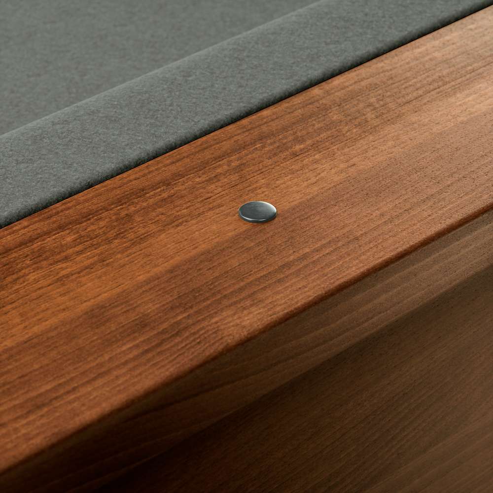 Grey Crate & Barrel Walnut Pool Table with Wall Rack and Accessories in close up on the walnut rail with a small metal sight dot beside the grey felt