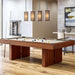 Khaki Crate & Barrel Walnut Pool Table with Wall Rack and Accessories at an angle in a game room under four pendant lights with coloured balls on the khaki felt and a wall cue rack behind
