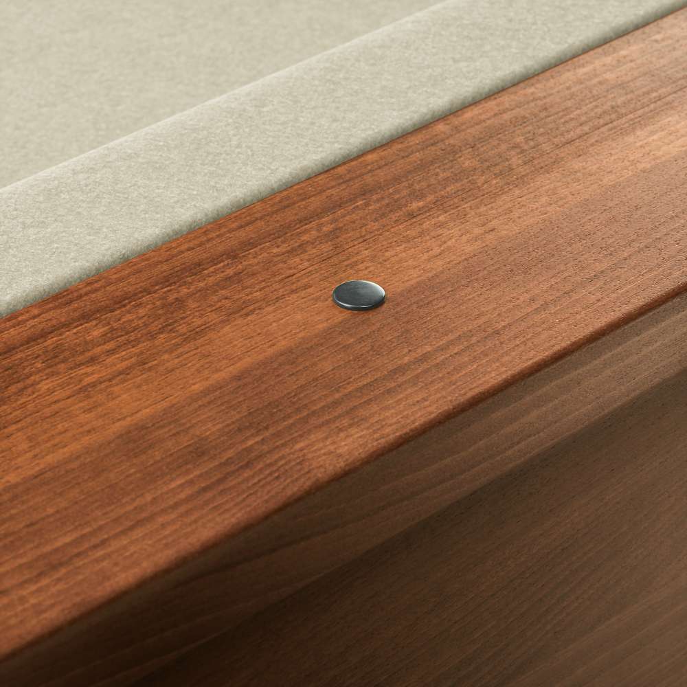 Khaki Crate & Barrel Walnut Pool Table with Wall Rack and Accessories in close up on the walnut rail with a small metal sight dot beside the khaki felt