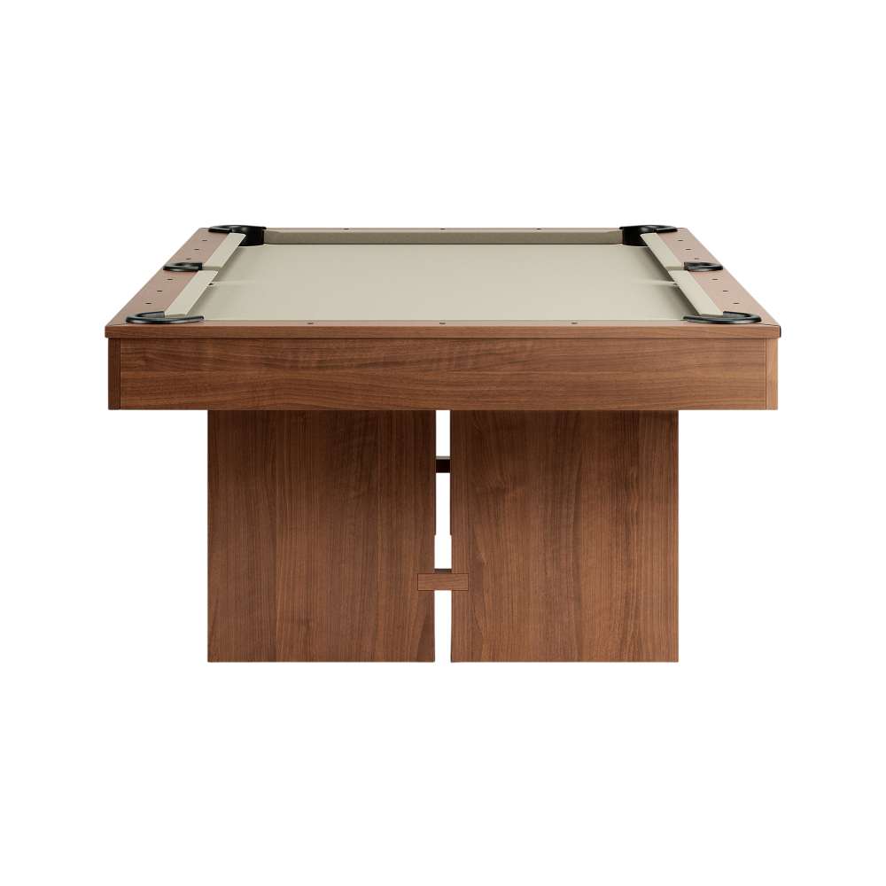 Khaki Crate & Barrel Walnut Pool Table with Wall Rack and Accessories seen straight from the end against a white background with khaki felt, the corner pockets and two slab legs