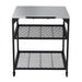 Large Ooni Modular Table front view of the wide stainless top with two black mesh shelves and four black legs.
