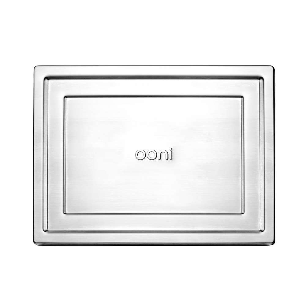 Medium Ooni Detroit Pizza Pan overhead view of the brushed stainless steel lid on its own with the ooni logo embossed in the recessed center panel.