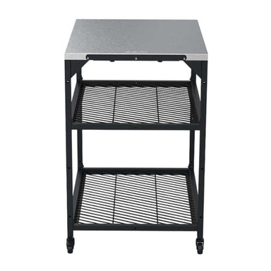 Medium Ooni Modular Table with a stainless top, two black mesh shelves and casters on the feet.