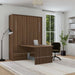 Modern Walnut Inovabed Murphy Bed with Desk closed in a bright room set up as a home office, with a laptop on the table and a black office chair pulled up to it