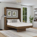 Modern Walnut Inovabed Murphy Bed with Desk opened in a bright bedroom with white bedding, a striped lumbar pillow and two framed botanical prints above the headboard